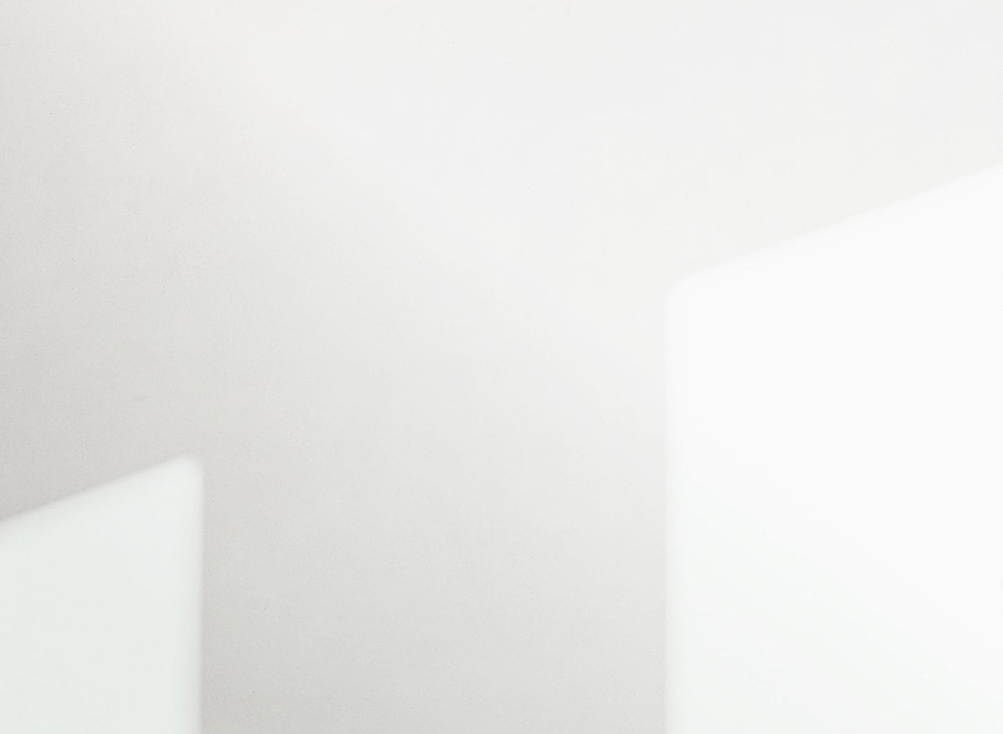 Woman in elegant dress, basking in sunlight.